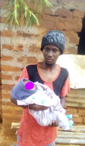 Alex Ndivo Mutua with his one month old baby boy